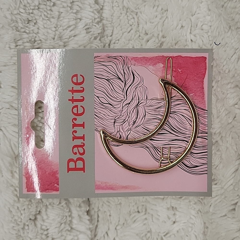 Pretty gold half moon barrette.